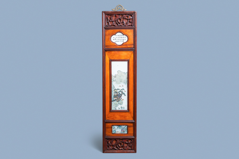 A Chinese carved wooden panel with landscape plaques, 19/20th C.